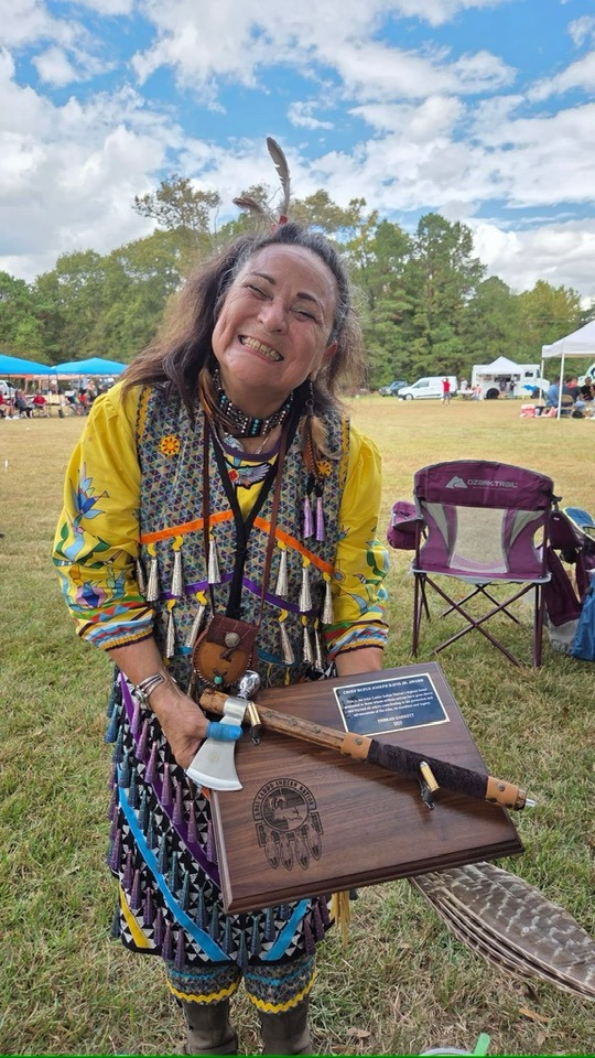 Deb Solice Garrett with the Chief Rufus Davis Jr. Award at the 2025 Powwow